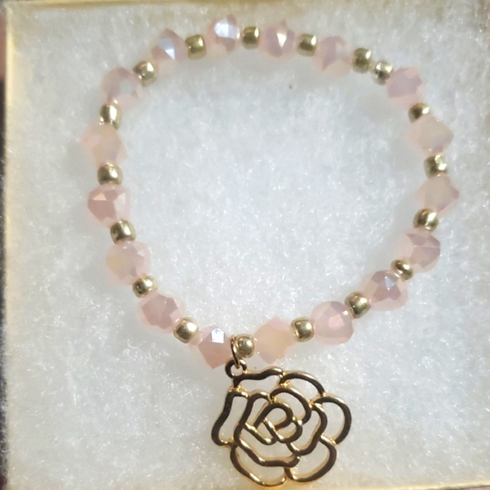 Handmade by my daughter. Elegant Gold flower charm Bracelet with Pink Beads